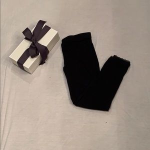 Black leggings with fringed bottoms